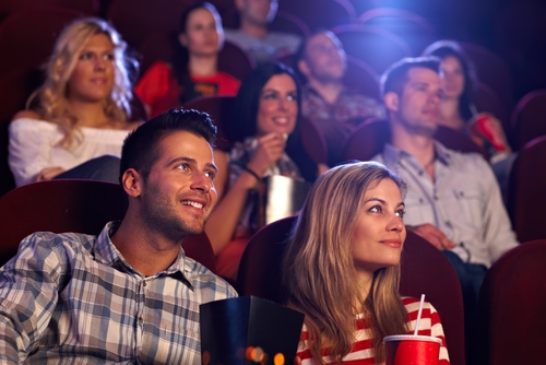 Young couple watching a movie after LASIK eye surgery